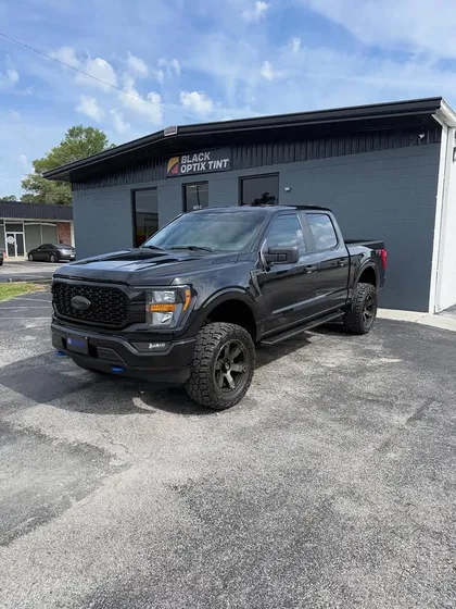 Black Ford F-150 tinted at the shop
