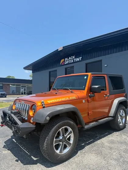 Orange Jeep Wrangler with 20% tint all around